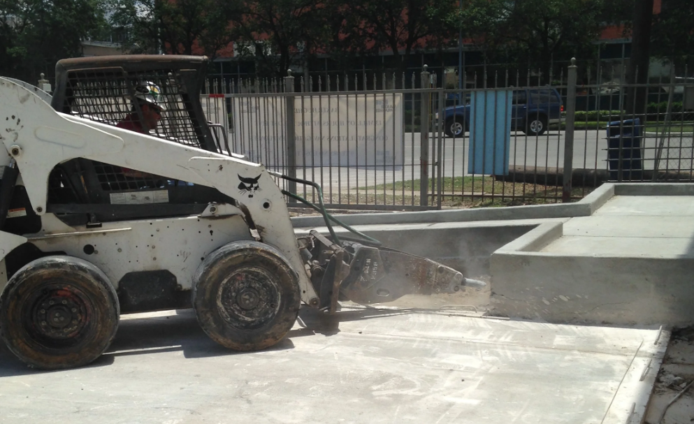 Hydraulic breaker removing reinforced concrete section (11)